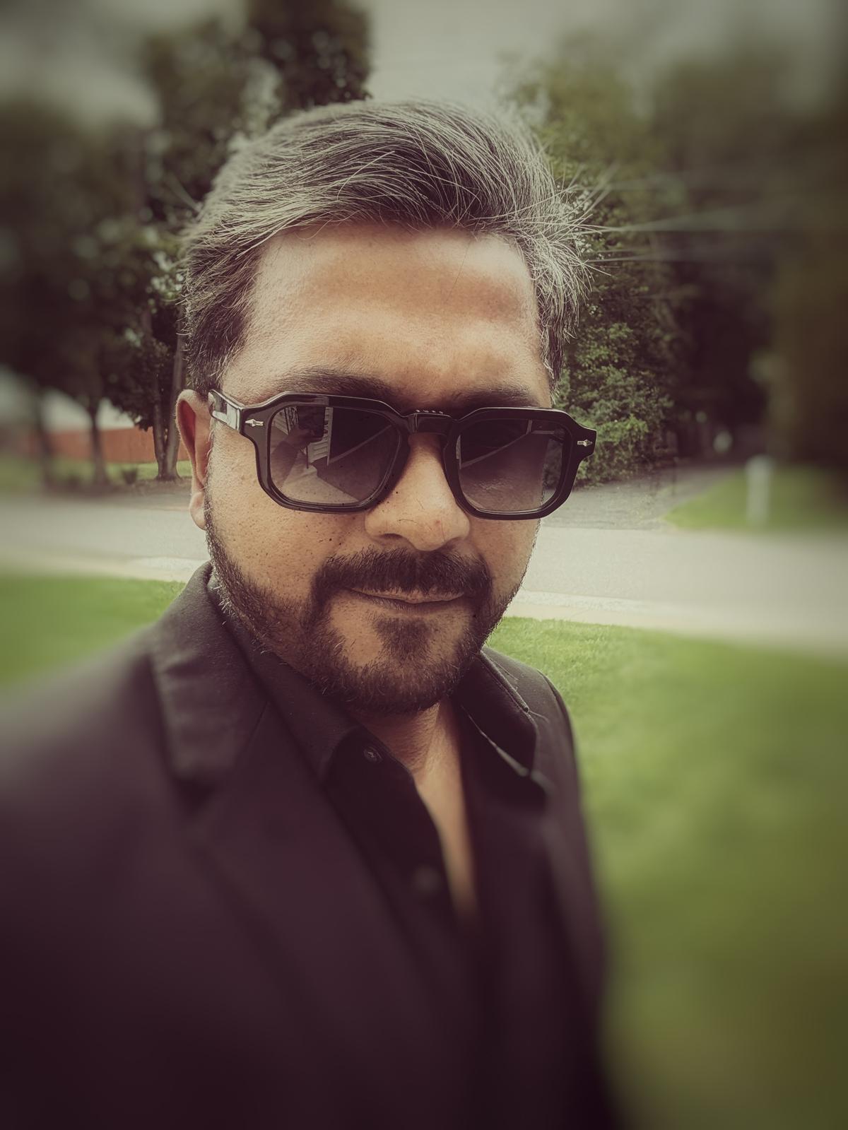 Laji George outdoor portrait with sunglasses
